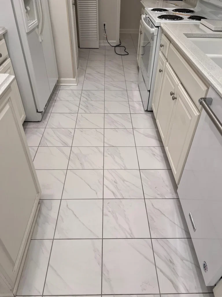 Kitchen tile floor with bright tile and grout after cleaning